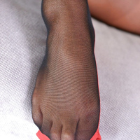 Leggy European babe Natalia Forrest freeing barefeet from pantyhose