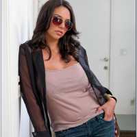 Latina babe Missy Martinez has big tits under her blouse and shows it