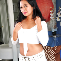 Oiled Asian pornstar Lucky Starr demonstrates her slim legs