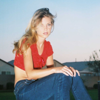 Ashley is outside on the play ground in tight jeans and a tiny red top I love to