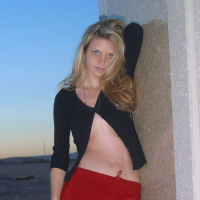Ashley outside black top red long skirt