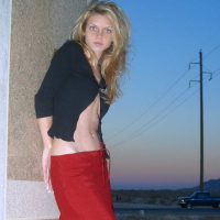 Ashley outside black top red long skirt