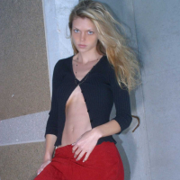 Ashley outside black top red long skirt