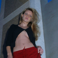 Ashley outside black top red long skirt