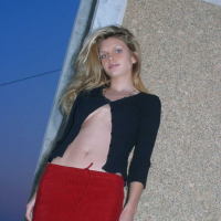 Ashley outside black top red long skirt