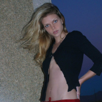 Ashley outside black top red long skirt