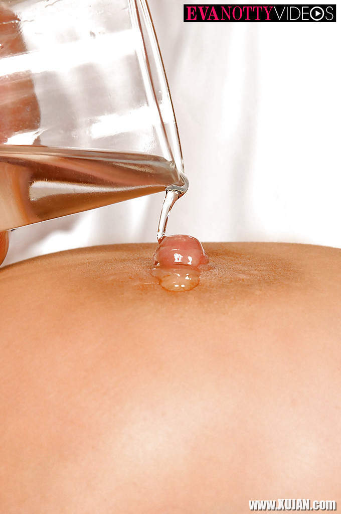 Busty MILF Eva Notty having big tits and nipples oiled on massage table - Photo #1326111