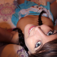 Brunette teen Andi Land cosplays as Alice in Wonderland