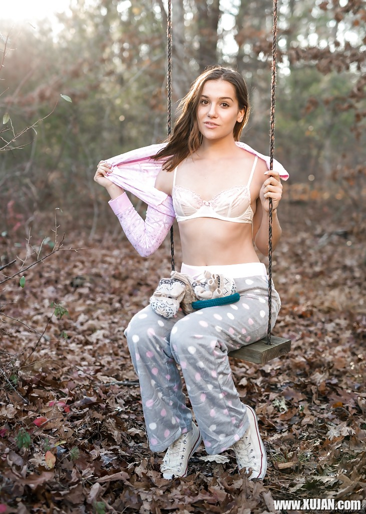Solo girl Kasey Warner undressing for nude shoot outdoors in woods clearing - Photo #1330993