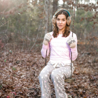 Solo girl Kasey Warner undressing for nude shoot outdoors in woods clearing