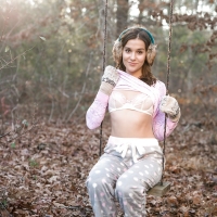 Solo girl Kasey Warner undressing for nude shoot outdoors in woods clearing