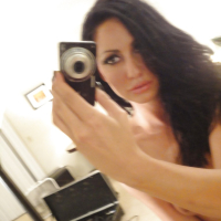 Solo girl Tiffany Brookes unveiling small breasts while taking selfies