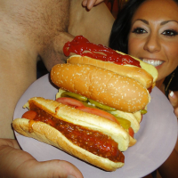 Brunette chick Tiffany Brookes licking large cock wrapped in hot dog bun