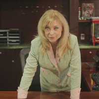 Blonde mature babe Nina Hartley is showing her big tits in stockings