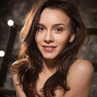 Adel Morel bares her sweet pussy as she poses on the chair