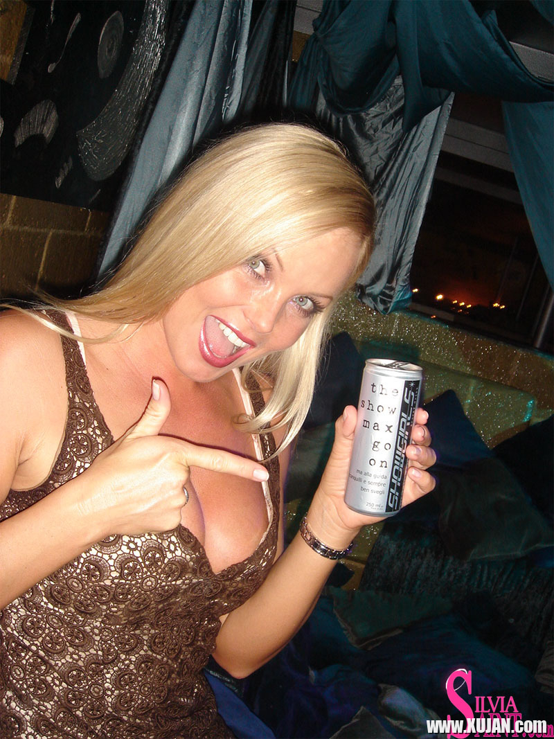 Blonde MILF Silvia Saint fully clothed posing flaunting big tits at party - Photo #1357157