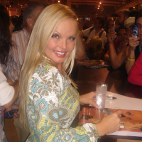Sexy pornstar MILF Silvia Saint posing fully clothed in jeans and boots