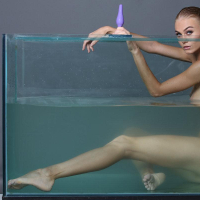 Blonde teen Nancy A masturbates under water in Aquarium