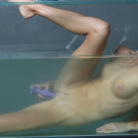 Blonde teen Nancy A masturbates under water in Aquarium