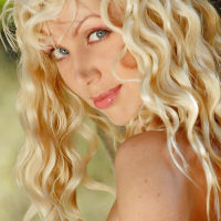 Blonde Natali posing outside