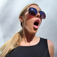 Ravishing blonde babe Samantha Saint posing fully clothed and doing upskirt