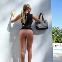 Ravishing blonde babe Samantha Saint posing fully clothed and doing upskirt