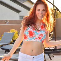 Redhaired goddess Zara Ryan slides a big dildo in her vagina