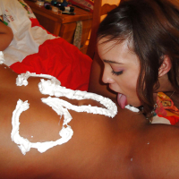 Lesbian Ivy Winters puts cream on Melanie Rios tits and ass and licks it off