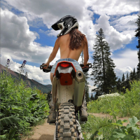 Elena Generi looks hot posing with a dirt bike
