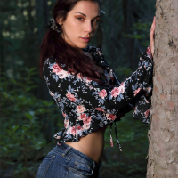 Elena Generi shows her hairy pussy in the forest