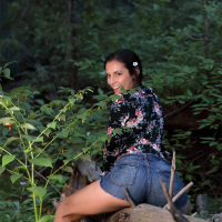 Elena Generi shows her hairy pussy in the forest