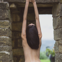 Sexy Sade Mare poses naked on the steps outside