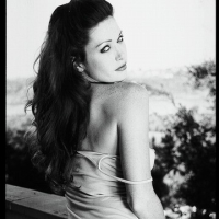 Black and white set of Aimee Sweet posing outdoors