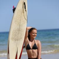 Sexy Monica Sweet gets naked and goes surfing