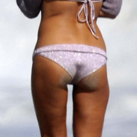 Olivia Munn posing and showing her sexy body and nice ass in bikini