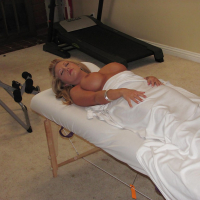 Blond mom Heather Summers shows off nice tits after disrobing on massage table