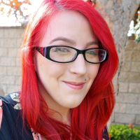 Redhead Bimbo Kamille Amora exposes her huge Tits