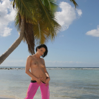 Liz Valery strips and shows tits and pussy outdoor on the beach