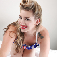 Chesty USA pinup babe September Carrino flaunting huge knockers