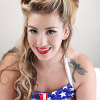 Chesty USA pinup babe September Carrino flaunting huge knockers