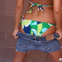 Kate posing outside in her bikini