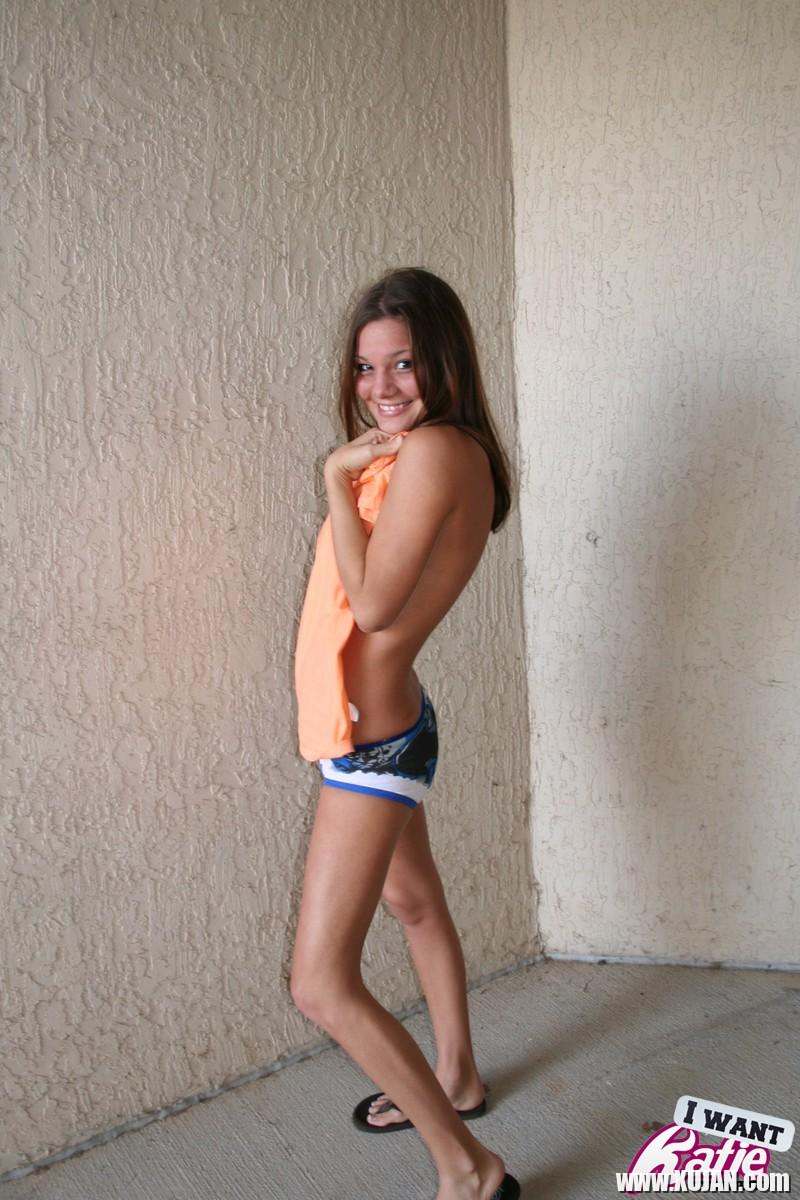 Watch as Katie takes off her cute tshirt and teases with her perky tits - Photo #1449767