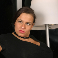 Aneta Buena showing her Melons in a black Dress