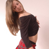 Cute girl Sarah shows off in her new plaid skirt