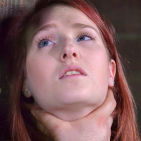Ashley Lane redhead rope bound with tits exposed and ass toyed