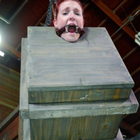 Ashley Lane redhead bound in dungeon with leather and dribbling