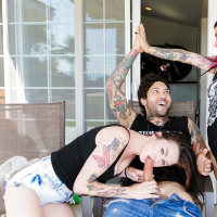 Tattooed dark haired slut in short skirt gives hot handjob during threesome