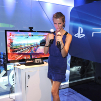 Brooklyn Decker showing big cleavage in blue mini dress at PlayStation booth at