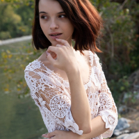 Shy young cutie Ohana Petite seductively reveals smooth skin by the river