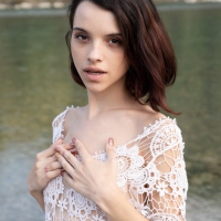 Shy young cutie Ohana Petite seductively reveals smooth skin by the river
